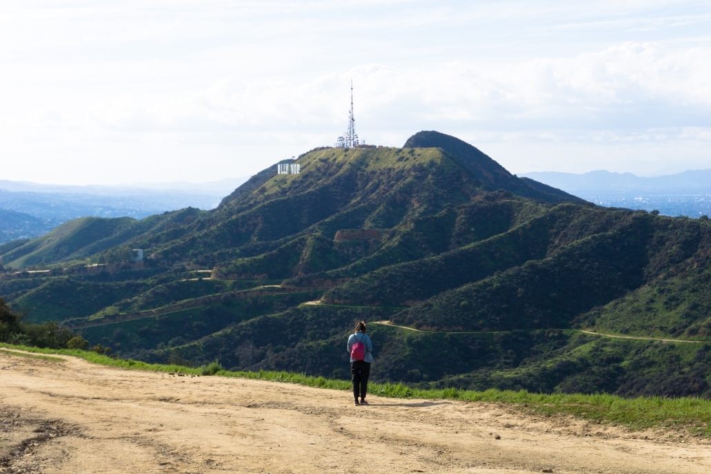 hiker on the north trail near mount hollywood with mount lee behind her